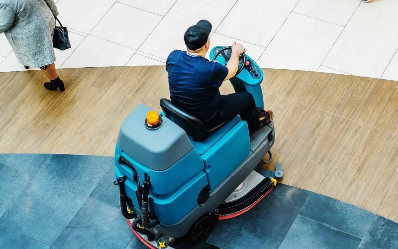 floor washcloth. Washing floors in a shopping center. Cleaning in a large industrial area using automated equipment. Top down view